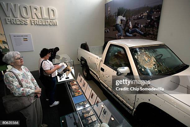 The public gets its first look at the bullet- and shrapnel-riddled truck used by Time Magazine photographers and reporters during the war in the...