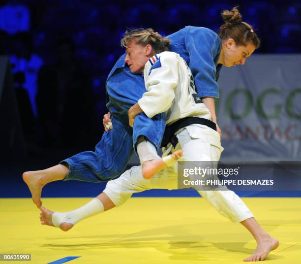 Frederique Jossinet of France fights with Alina Dumitru of Romania in the women's under 48 kg final of the Euro Judo Championship in Lisbon, on 11...