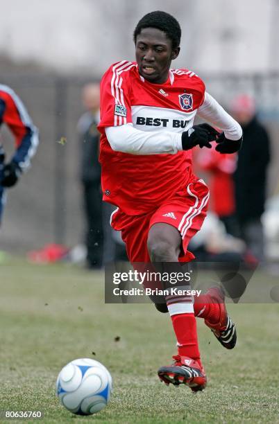 Patrick Nyarko of the Chicago Fire dribbles against the New England Revolution at the Toyota Park practice field on April 4, 2008 in Bridgeview,...