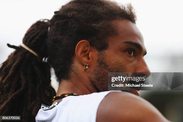 Dustin Brown of Germany looks on during the Gentlemen's Singles first round match against Joao Sousa of Portugal on day one of the Wimbledon Lawn...