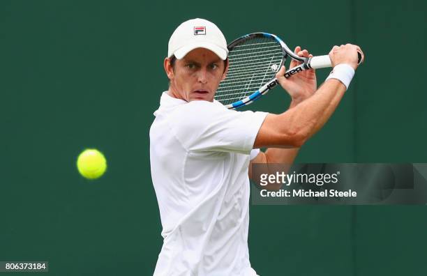 Andrew Whittington of Australia plays a backhand during the Gentlemen's Singles first round match on day one of the Wimbledon Lawn Tennis...