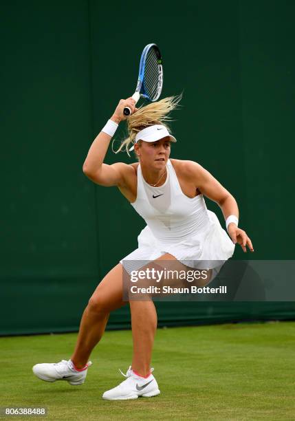 Carina Witthoeft of Germany plays a forehand during the Ladies Singles first round match against Mirjana Lucic-Baroni of Croatia on day one of the...