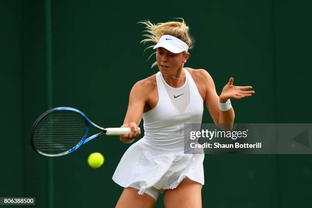 Carina Witthoeft of Germany plays a forehand during the Ladies Singles first round match against Mirjana Lucic-Baroni of Croatia on day one of the...