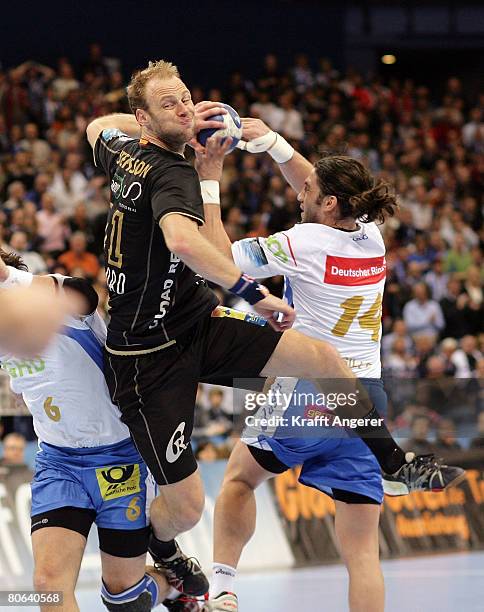 Olafur Stefansson of Ciudad challenges for the ball with Bertrand Gille and Iwan Ursic of Hamburg during the EHF Champions League semi final match...