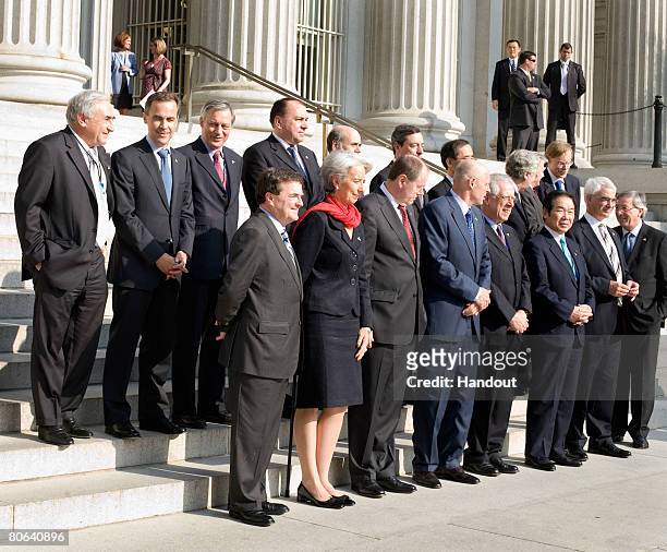 In this photo provided by the International Monetary Fund , G7 finance ministers Canadian Finance Minister Jim Flaherty, French Finance Minister...
