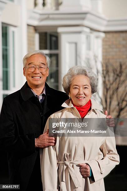 elderly couple smiling at camera - stereotypically upper class stock pictures, royalty-free photos & images