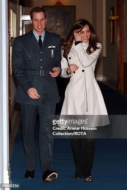Prince William walks with his girlfriend Kate Middleton after his graduation ceremony at RAF Cranwell on April 11, 2008 in Cranwell, England.
