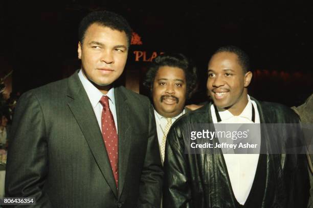 Boxer Muhammad Ali and Reverend Al Sharpton with RnB singer Freddie Jackson at Tyson vs Holmes Convention Hall in Atlantic City, New Jersey January...