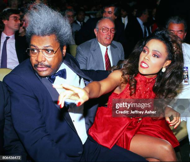 Boxing Promoter Don King with Actress Robin Givens ringside at Tyson vs Holmes Convention Hall in Atlantic City, New Jersey January 22 1988.