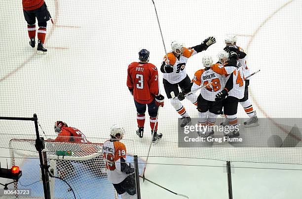 Daniel Briere of the Philadelphia Flyers celebrates with teammates after scoring against the Washington Capitals during the second period of game one...