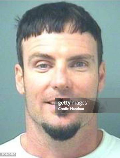 In this handout image provided by the Palm Beach County Sheriff's Office, rapper Vanilla Ice, whose real name is Robert Van Winkle, poses for his mug...