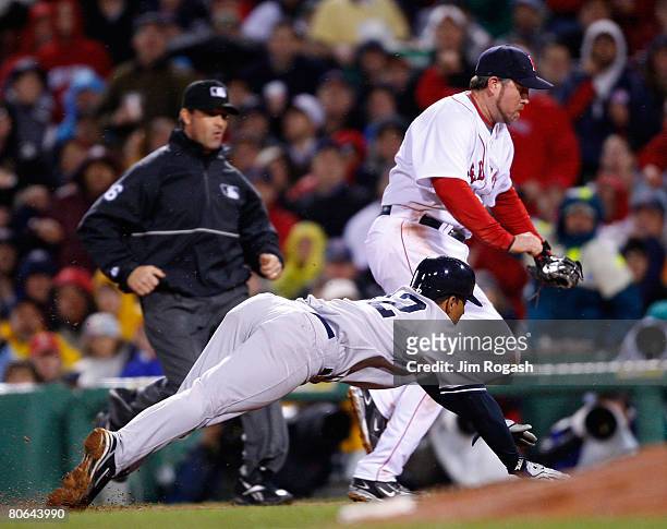 After catching a line drive, Sean Casey of the Boston Red Sox beats Alberto Gonzalez of the New York Yankees to first to make the double play in the...