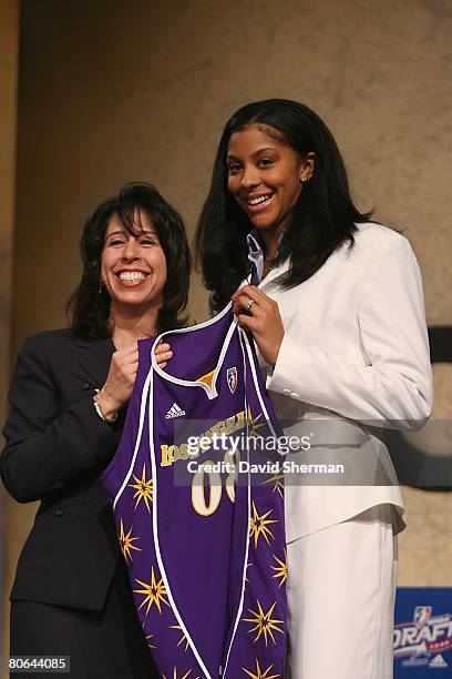 Commissioner Donna Orender presents a jersey to Candace Parker of the University of Tennessee, number 1 overall pick by the Los Angeles Sparks during...