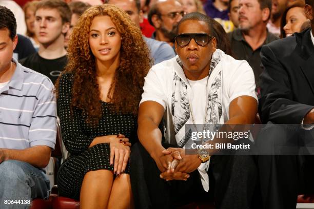 And hip-hop singers Beyonce Knowles and Jay-Z watch the game at the Toyota Center April 11, 2008 in Houston, Texas. NOTE TO USER: User expressly...