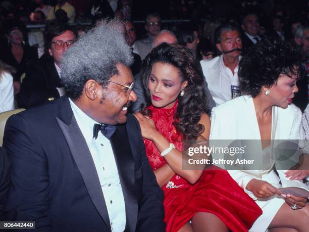 Boxing Promoter Don King with Actress Robin Givens and Robins mother ringside at Tyson vs Holmes Convention Hall in Atlantic City, New Jersey January...