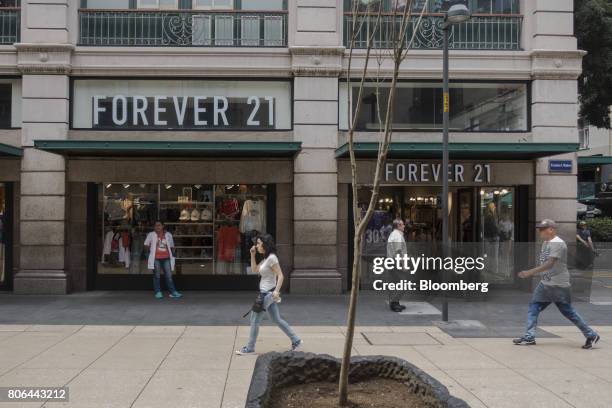 Pedestrians pass in front of a Forever 21 Inc. Store on Francisco I. Madero Avenue in Mexico City, Mexico, on Monday, June 26, 2017. The National...