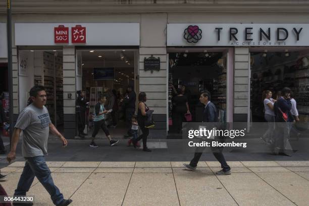 Pedestrians pass in front of stores on Francisco I. Madero Avenue in Mexico City, Mexico, on Monday, June 26, 2017. The National Institute of...