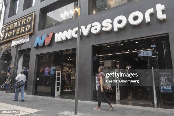 Pedestrians pass in front of a Innova Sport store on Francisco I. Madero Avenue in Mexico City, Mexico, on Monday, June 26, 2017. The National...