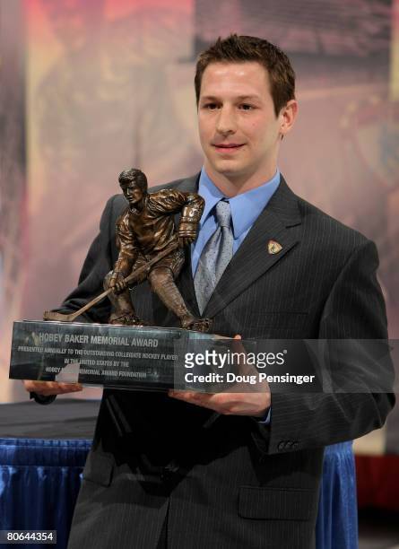 Kevin Porter of the Michigan Wolverines is awarded the 2008 Hobey Baker Award at a ceremony during the 2008 Frozen Four Men's Ice Hockey National...