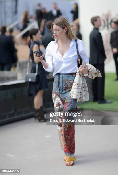 Camille Rowe attends the Christian Dior Haute Couture Fall/Winter 2017-2018 show as part of Haute Couture Paris Fashion Week on July 3, 2017 in...