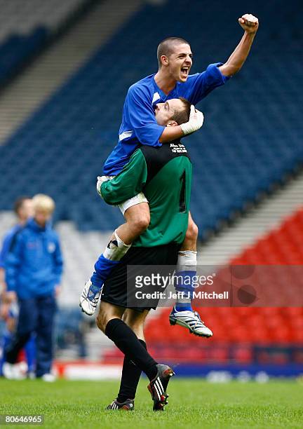 Robert Harris and Jamie MacDonald of Queen of the South celebrate after beating Aberdeen during the Scottish Cup Semi Final between Queen of the...