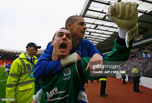 Robert Harris and Jamie MacDonald of Queen of the South celebrate after beating Aberdeen during the Scottish Cup Semi Final between Queen of the...