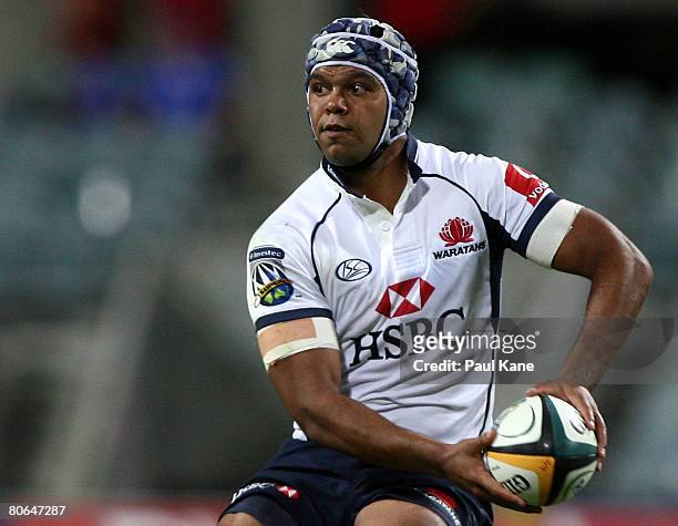 Kurtley Beale of the Waratahs looks for a pass during the round nine Super 14 match between the Western Force and the Waratahs at Subiaco Oval on...