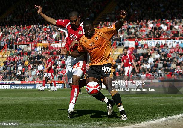 George Elokobi of Wolves battles with Marvin Elliott of Bristol during the Coca-Cola Championship match between Bristol City and Wolverhampton...