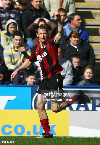 Brian McBride of Fulham celebrates after he scored his teams first goal during the Barclays Premier League match between Reading and Fulham at the...