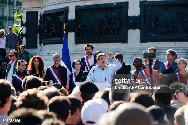 La France Insoumise leftist party's leader and Member of Parliament Jean-Luc Melenchon delivers a speech as LFI lawmakers Daniele Obono , Clementine...