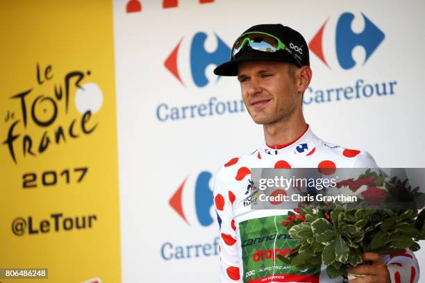 Nathan Brown of United States riding for Canondale Drapac in the king of the mountains jersey poses for a photo on the podium after stage three of...