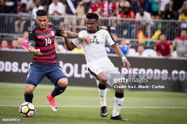 Dom Dwyer of U.S. Mens National Team fights for control against Jerry Akaminko of the Ghana National Team during the International Friendly Match...