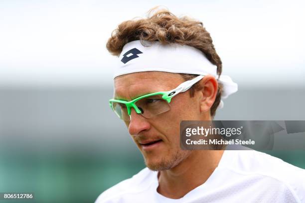 Denis Istomin of Uzbekistan looks on during the Gentlemen's Singles first round match against Donald Young of the United States on day one of the...