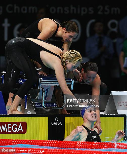 The United Kingdom team congratulate Melanie Marshall of United Kingdom on her final leg to win the bronze medal in the Women's 4 x 100m Freestyle...