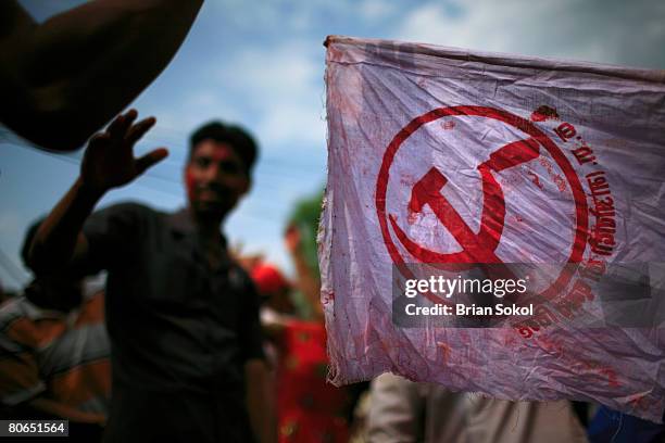 Nepali Moist supporters dance and wave communist flags during a victory celebration outside of a vote counting center April 12, 2008 in Kathmandu,...