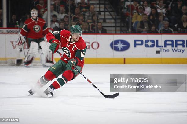 Marian Gaborik of the Minnesota Wild skates with the puck against the Colorado Avalanche during Game One of the Western Conference Quarter-Final of...