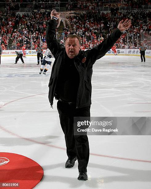 Al Sabotka, the Detroit Red Wings Zamboni guy, reves up the fans and twirls an octopus tossed to the ice from the crowd before game one of the 2008...