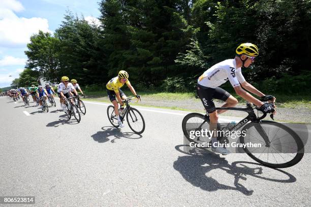 Christopher Froome of Great Britain riding for Team Sky and Geraint Thomas of Great Britain riding for Team Sky in the yellow leader's jersey rides...