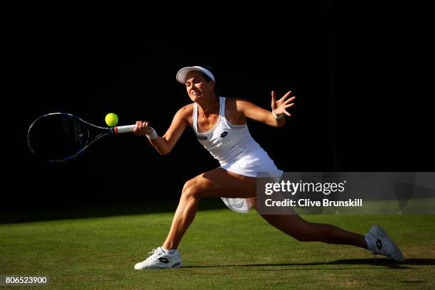 Jana Cepelova of Slovakia plays a forehand during the Ladies Singles first round match against Caroline Garcia of France on day one of the Wimbledon...