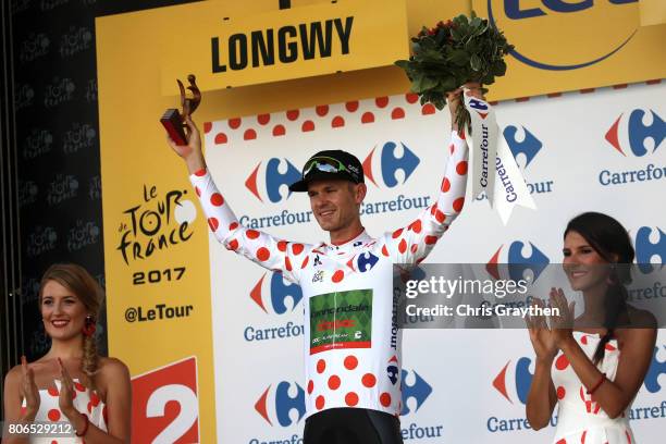 Nathan Brown of United States riding for Canondale Drapac in the king of the mountains jersey poses for a photo on the podium after stage three of...