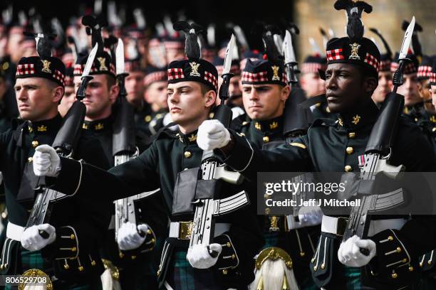 The guard of honour, Balaklava Company, The Argyll and Sutherland Highlanders, 5th Battalion The Royal Regiment of Scotland is inspected by Queen...