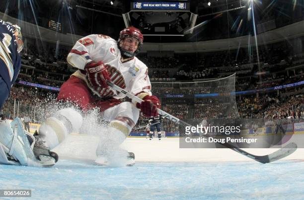 Nathan Gerbe of the Boston College Golden Eagles skates away after having a shot stopped by goaltender Jordan Pearce of the Notre Dame Fighting Irish...