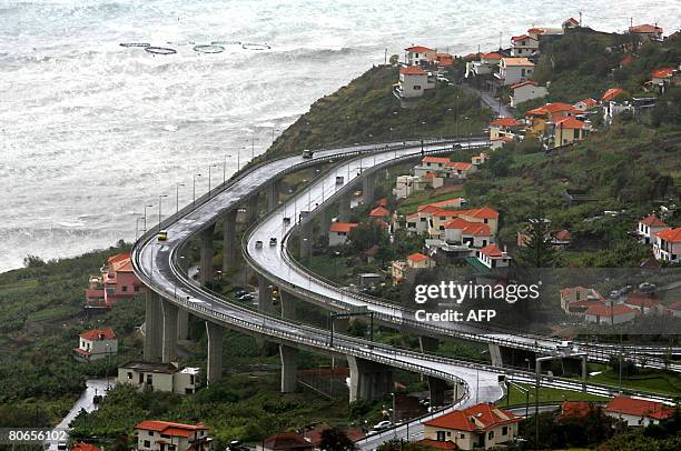 Cars drive on the highway connecting Ribeira Brava to Funchal, the capital of the Portuguese autonomous archipelo of Madeira, on April 9, 2008. Over...
