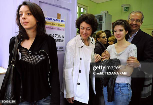 Centre-left leader Walter Veltroni arrives with her daughters Martina , Vittoria and his wife Flavia at a polling station in Rome on April 13, 2008....