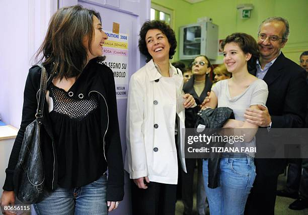 Centre-left leader Walter Veltroni arrives with her daughters Martina , Vittoria and his wife Flavia at a polling station in Rome on April 13, 2008....