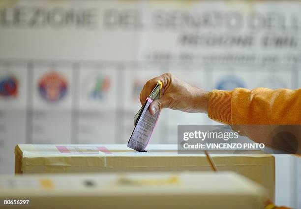 Italy's voter casts their ballots at a polling station in Bologna on April 13, 2008. Italians began voting in general elections likely to usher...