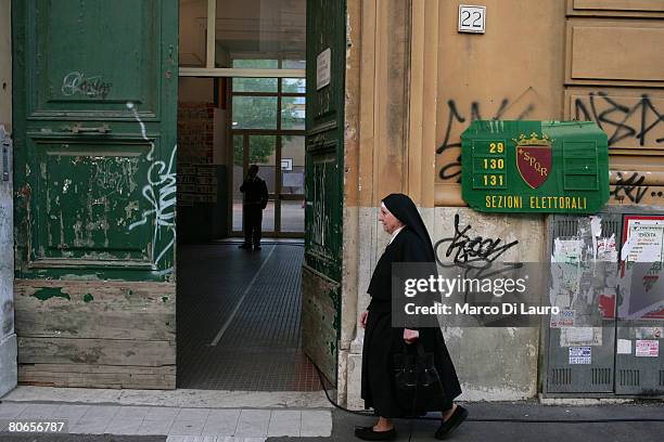 Nun arrives to a polling station to cast her vote in Italian parliamentary election on April 13, 2008 in Rome, Italy. 47 millions of Italian are...