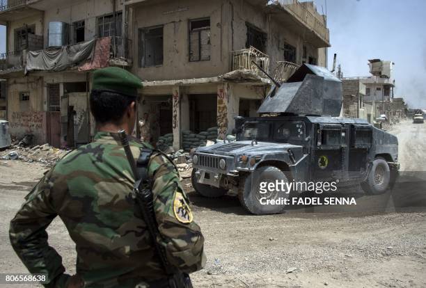 An Iraqi Counter-Terrorism Service humvee is seen at the exit of the Old City of Mosul on July 3, 2017 during an ongoing offensive to retake the city...