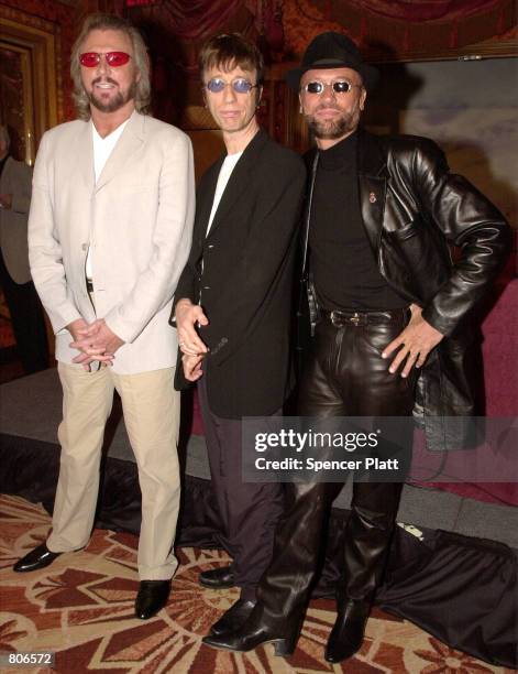 S rock/disco group, The Bee Gees pose for the photographer at a press conference April 23, 2001 in New York prior to announcing the release of their...