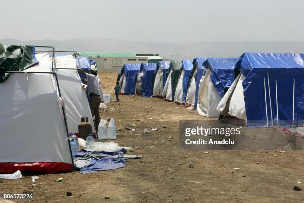 Tents, built by United Nations teams and Lebanese Red Cross within the infrastructure works, are seen at the Qob Elias refugee camp after a big fire...